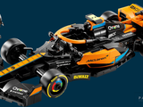 a lego model of a racing car on a blue background