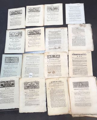 several old books are stacked on top of each other on a table