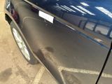 a close up of a car door with a sticker on it