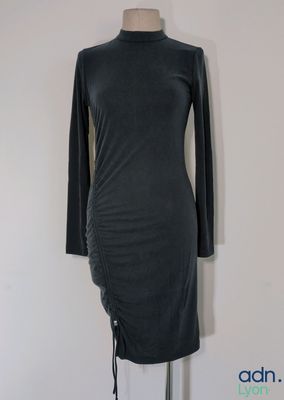 grey dress on a mannequin stand on a white background
