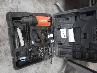 a black case with tools inside of it on the floor