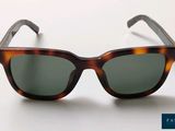 a pair of sunglasses sitting on a white surface
