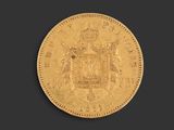 a gold sovereign coin with a crown on it
