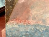 a picture of a painting on display in a glass case