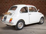 a small white car with a pizza on the back of it