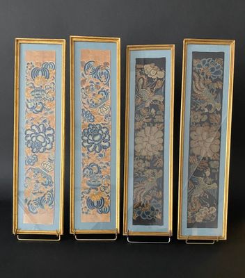 four framed art pieces of different colors and designs on a black background