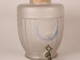 a glass jar with a cork stopper on top of it