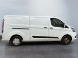 the white van is parked in a room with a gray floor