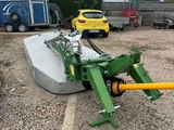 an image of a tractor with a large blade attached to it ' s back