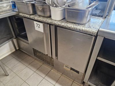 many pots and pans on the counter in the kitchen