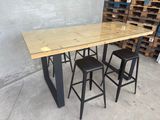 the table is made out of wood and has four stools