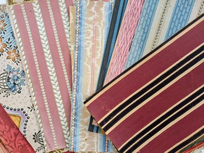 several pieces of fabric are laid out on a table
