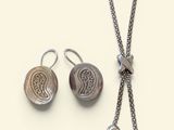 necklace and earring set with silver beads on a white background