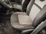 an image of a dirty car seat with a dirty cloth on it