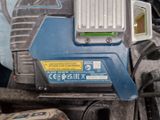 an image of a blue and white cordless drill