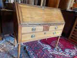 a wooden desk with two drawers on it in a room