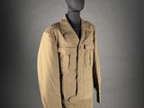 an old uniform worn by a soldier on display on a mannequin