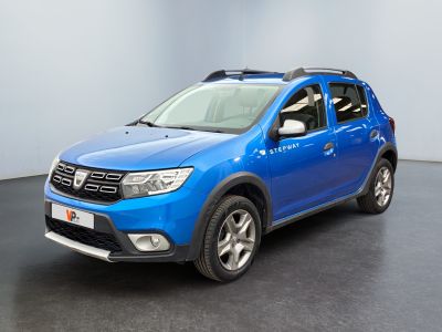 the blue dacia is parked in a room with a black floor