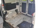 a white van with a flat bed in the back of it