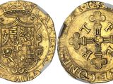 a gold coin with a cross on the front and a shield on the back