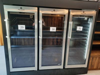 two refrigerators that are on display in a store