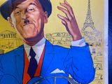 a poster of a man in a blue suit and hat