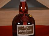 a bottle of grand marnier sitting on a table