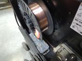 a close up of a machine that has a wire on it