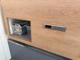a wooden cabinet with a digital clock on it