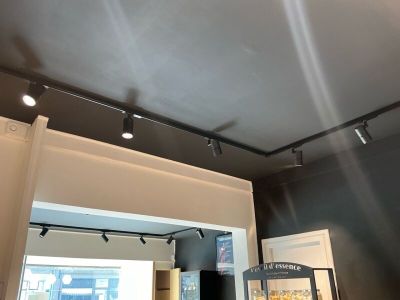 a picture of a room that has some lights on the ceiling