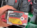 a man that is holding a battery in his hand