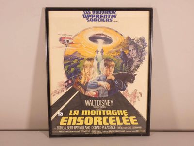 the poster for the movie la montagne ensoreee is hanging on the wall