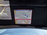 an image of a car dashboard with a sticker on it