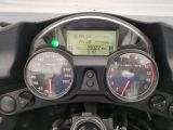 a close up of a motorcycle with a speedometer and gauges