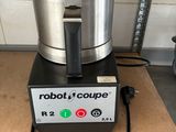 a robot coupe sitting on top of a counter