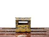 a small yellow and black box on the ground