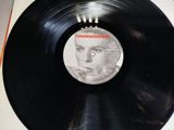 the record is sitting on the table with the label on it