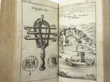 an open book with a drawing of a cross on it