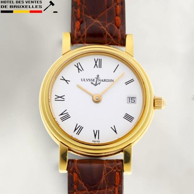 an image of a close up of a wrist watch with roman numerals