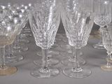 a lot of wine glasses sitting on a table