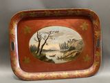 an old tray with a painting of a river scene on it