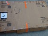 a cardboard box that is sitting on the ground