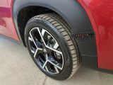 a close up of a tire on a red car