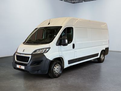 the white van is parked in a large room