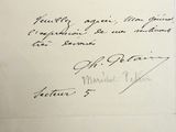 an old handwritten letter with a black ink writing on a piece of paper