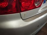 a close up of a white car with red lights