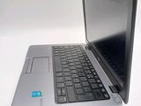 a laptop computer sitting on top of a white table