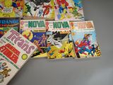 a lot of comic books on the table