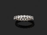 une bague « éternité » en diamants, signée Van Cleef