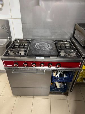 a kitchen with a stove, oven, microwave, and dishwasher in it